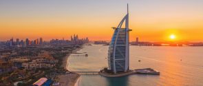 Aerial view of Burj Al Arab Jumeirah Island, Dubai Downtown skyline, United Arab Emirates or UAE. Financial district and business area in smart urban city. Skyscraper and high-rise buildings at sunset Aerial view of Burj Al Arab Jumeirah Island, Dubai Downtown skyline, United Arab Emirates or UAE. Financial district and business area in smart urban city. Skyscraper and high-rise buildings at sunset